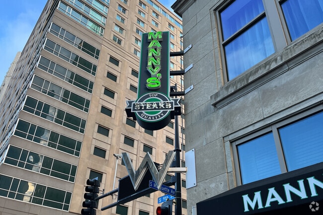 Manny's signage on the corner of S 5th street.