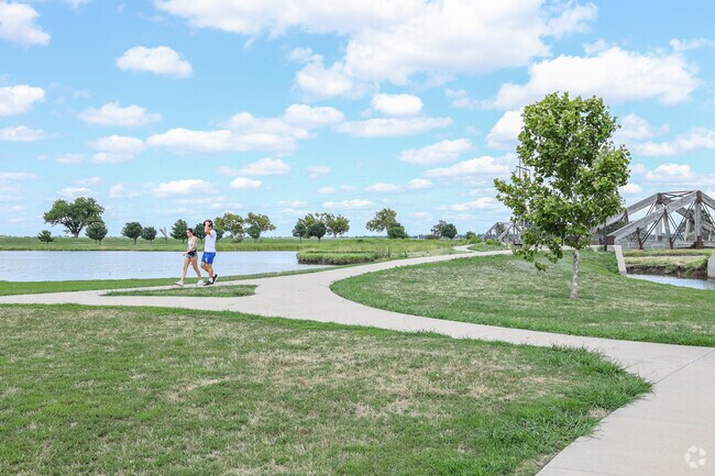 Walk the paved paths at Route 66 Park near Harvest Hills West.