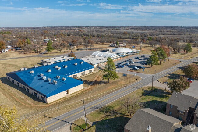 Russell Babb Elementary School sits across from the Harrah Heritage Park.