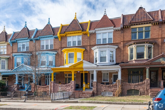 Here are some colorful gabled roof townhomes in Charles Village.