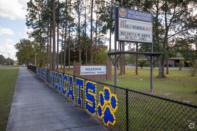 Wilkinson Elementary School parents stay updated via a pylon sign.