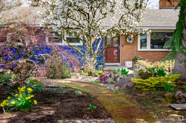 Flowers bloom in front of a ranch home in Glenfair.