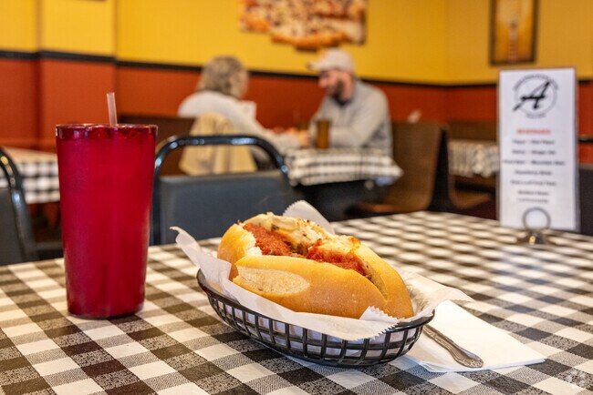 Savor the incredible hoagies and pies at Alpha Pizza & Sub Shop, in business since 1974.