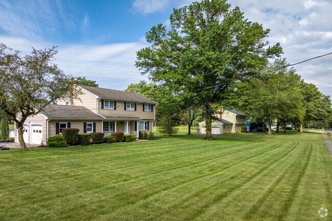 Colonial style homes on large lots line one of Bridgewater's more rural residential roads.