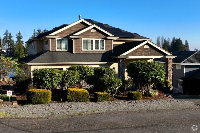 This beautiful craftsman home sits on a lake in Seatac.