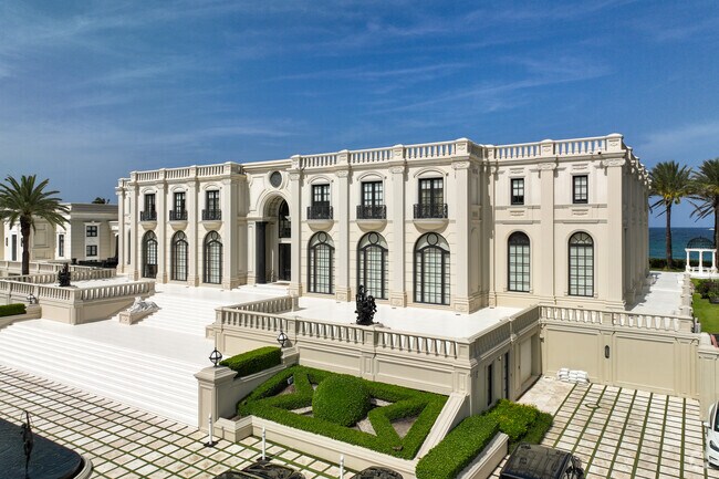Mega mansion built like a historical castle in Ocean Ridge neighborhood.