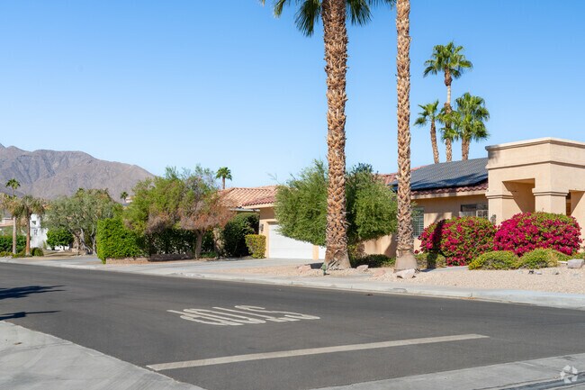 A row of colorful welcoming homes inside the Oasis del Sol neighborhood.