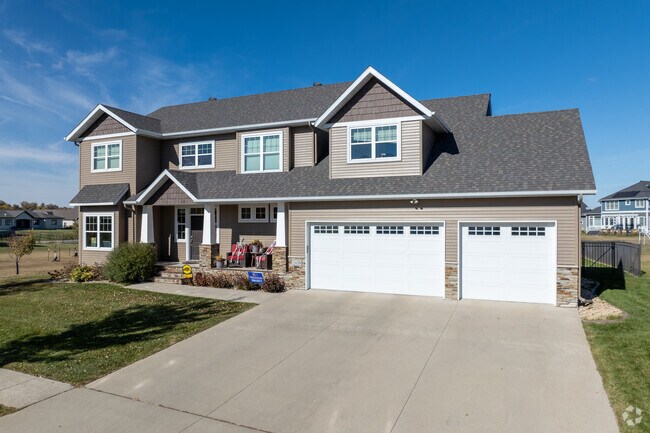 Contemporary homes in The Preserve's Maple Ridge area sport three car garages and acre lots.