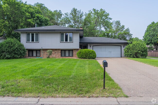 Norwood has many split-level homes with brick foundations and modern windows.