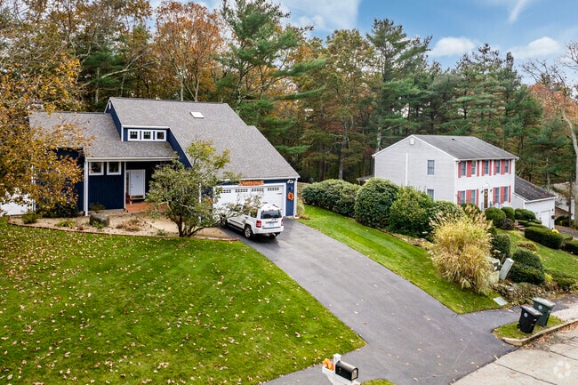 Homes in Coventry are set along soft hillsides and old trees that line the streets.