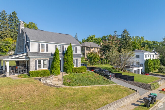 Colonial revivals sit perched on rolling hills with large lots in Highlands. The historic Highla