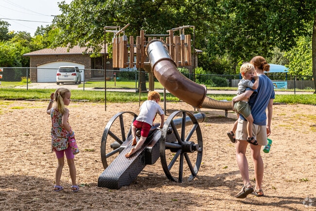 Children in Manhattan find adventure while climbing and running at Cico Park.