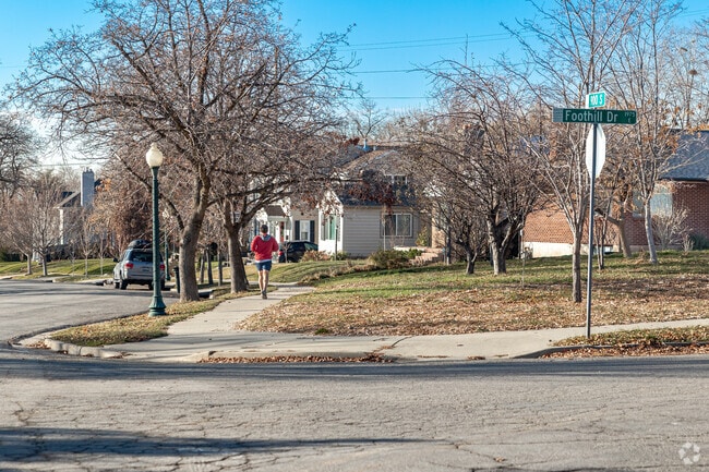A man runs down a side walk in Foothill Sunnyside.