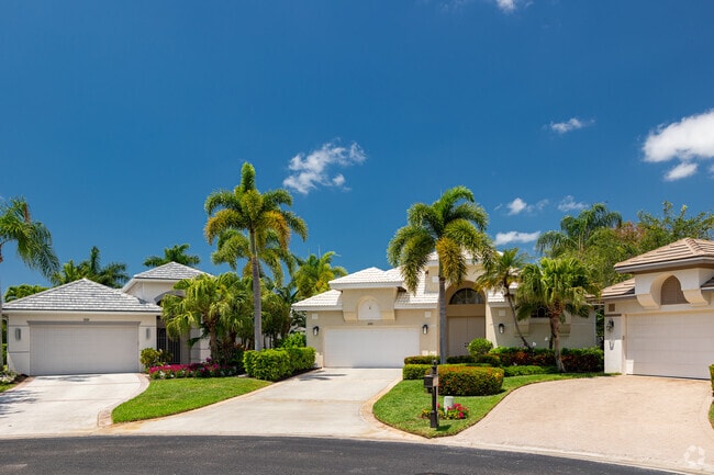 East Naples features stucco homes built in a traditional suburban layout.