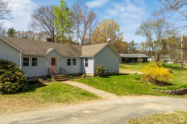 A quiet row of Royalston homes lines a winding country road.