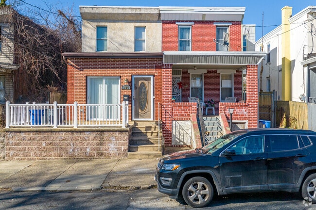 Some twin homes in Haddington come with small side yards with white picket fences.