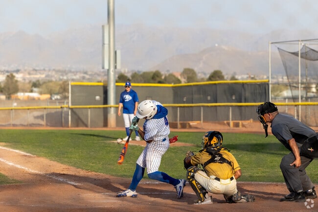 Familes gather at Field of Dreams Sports Complex to watch their kids swing for the fences.