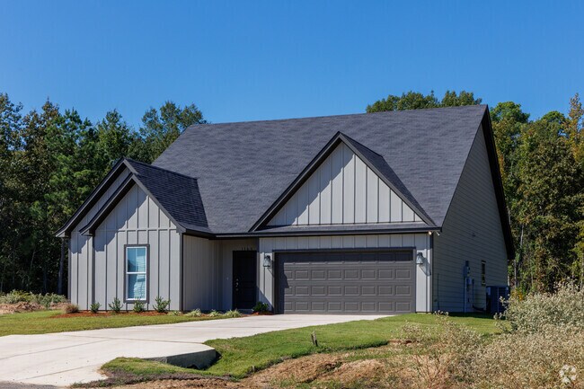 Farmhouse style home in Frierson with double garage.