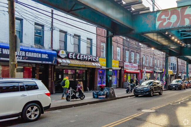 Although a bit noisy, the elevated subway passing over Fulton Street helps residents of Cypress Hills get into the city.