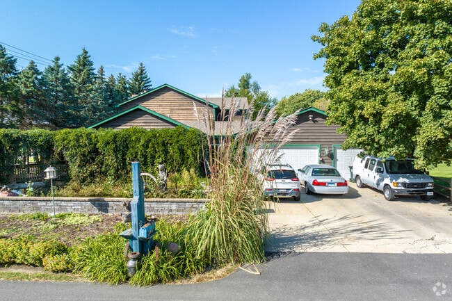 A unique home is hidden behind its hedges offering great privacy in West Shore Park.