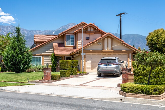 This stunning multi-story Spanish-style home adds elegance and character to Alta Loma’s residential landscape.