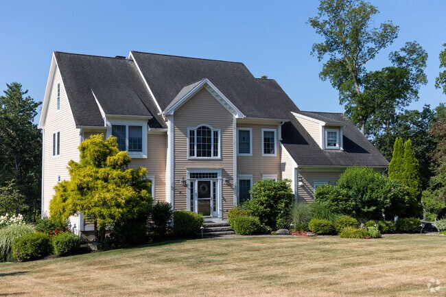 In Greenland, Colonial Revival homes reflect New England tradition with balanced, formal design.