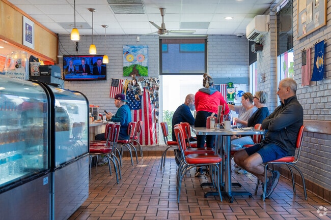 Indulge at Dandee Donut Factory, a local favorite near Highland Meadows.