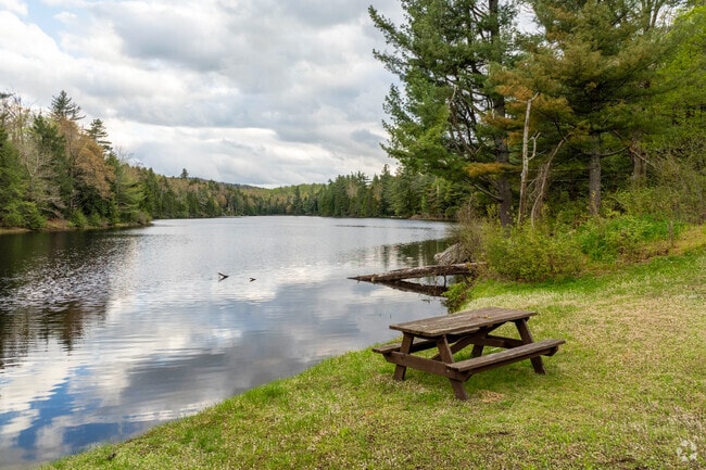A picnic table overlooks the beautiful Hallockville Pond in Plainfield, a popular spot for kayakers and fishermen.