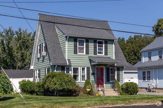 Elegance defines this Hillsgrove home with its wide dormer and pitched roof.