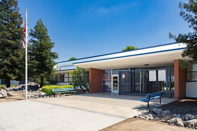 An American flag waves at the entrance of Strathmore High School.