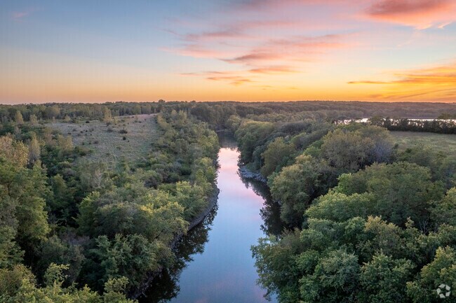 Enjoy serene river views in Near West, where nature meets suburban living.