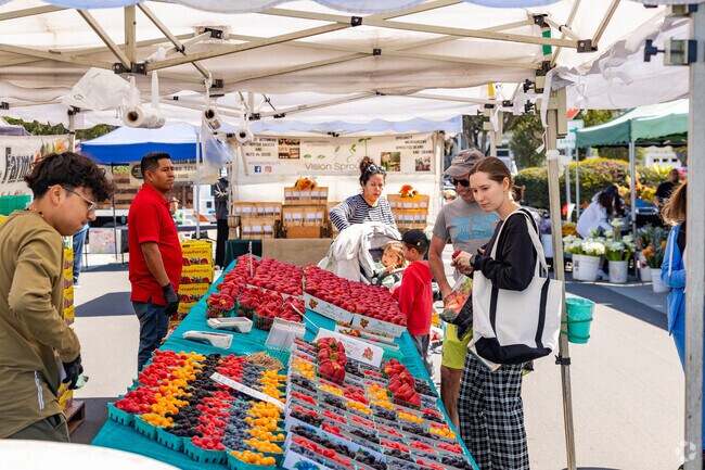 Several vendors at the Manhattan Beach Farmers Market offer fresh produce.