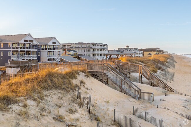 Vacation rentals along the shores of Kill Devil Hills offer ocean views and the relaxing sound of waves just steps away.