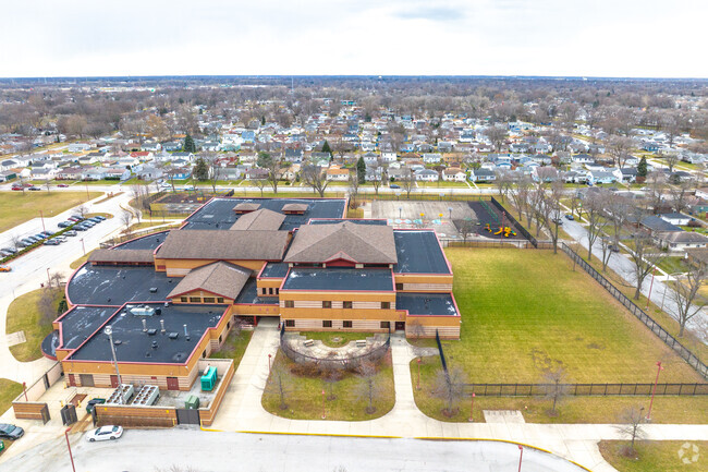 Thomas J Jefferson Elementary School has a green space along the building.