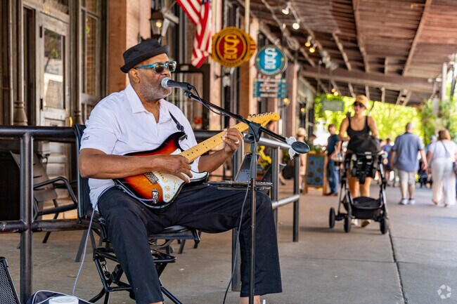 Bedford locals head downtown to enjoy live music throughout the day at The Old Market Farmers Market.
