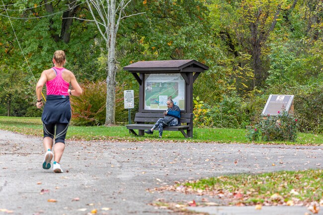 A resident sits and relaxes on a Lynch Park bench in Greensburg.