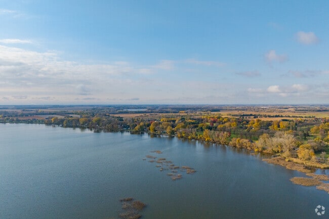 Broad shoreline and marsh flats support wildlife near Litchfield.
