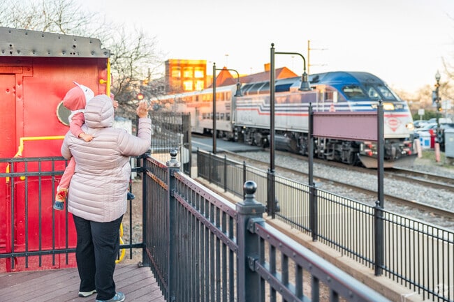 Catch the excitement of train travel in Manassas with this heartwarming moment.