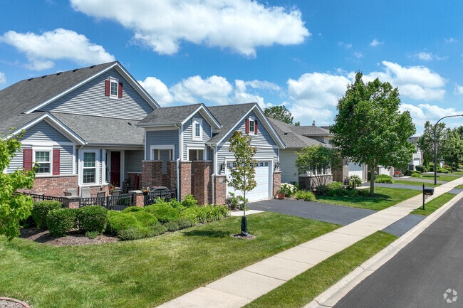 Two-story townhomes in Carillon Club offer shared backyards, blending privacy with community living.