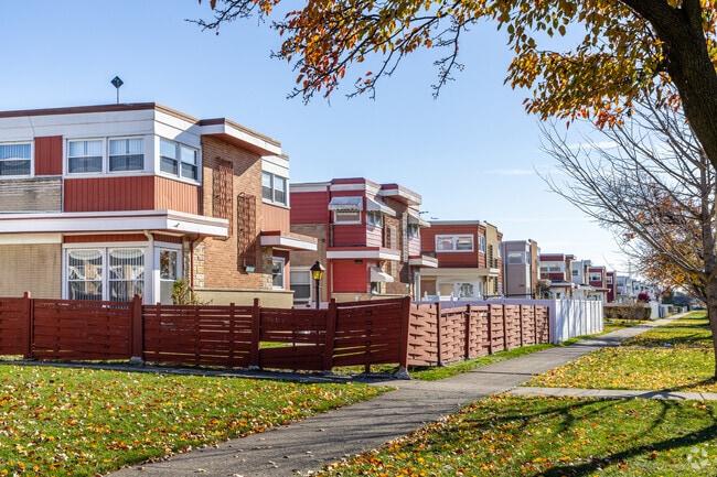 Housing options in Washington Park include townhouses with fenced yards.