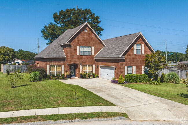 Beautiful two-story brick buildings stand in Semmes' Fire Tower neighborhood.