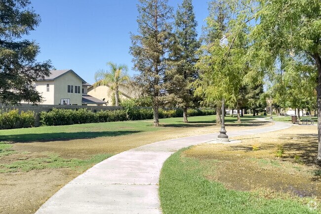 Granite Pointe Park has winding walking paths through green spaces and trees.