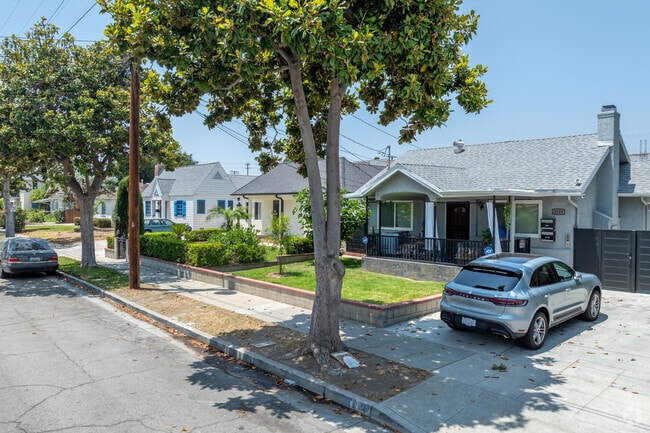 Well-tended gardens and mature trees surround these quaint homes in Mariposa, adding to their curb appeal.