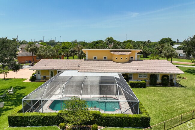 Covered pool in the backyard of a single-family home in Collier City.