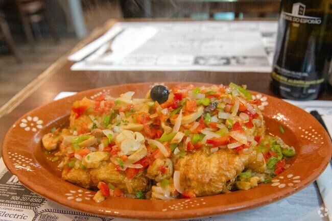 Captain's Codfish is a Portuguese dish steaming at Captains Place Restaurante in Acushnet.