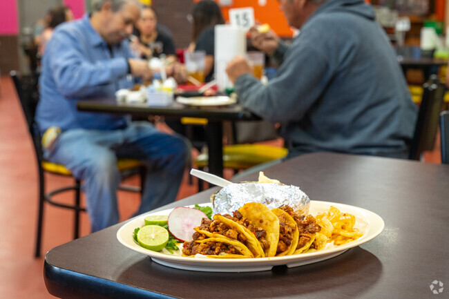 Tacos El Charly is a locally owned restaurant known for its cozy atmosphere and delicious tacos.