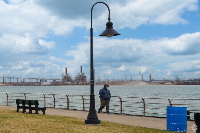 Residents enjoy walking along the boardwalk along the Detroit River in River Rouge.