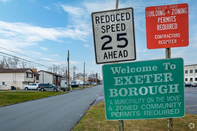 Signage welcomes you to Exeter Borough, PA, and that this is a residential neighborhood area.