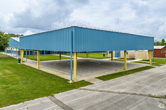 Wesley Chapel Elementary use the all weather protection roof on their outdoor court.