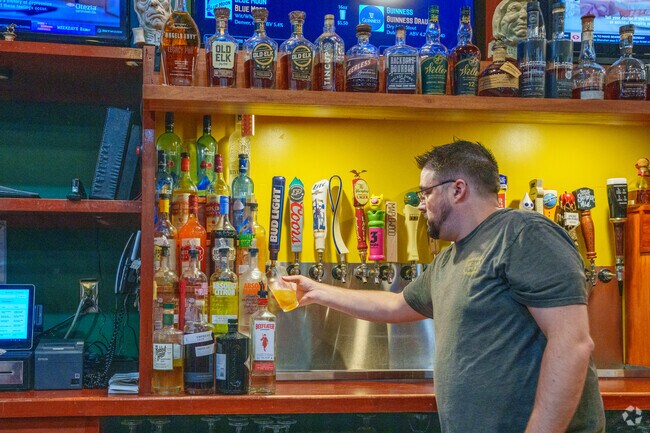 Watch the game and drink your beer from a frosted mug at Legacy Pub near Seasons Four.